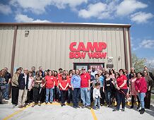 Camp Bow Wow Staff in front of Facility